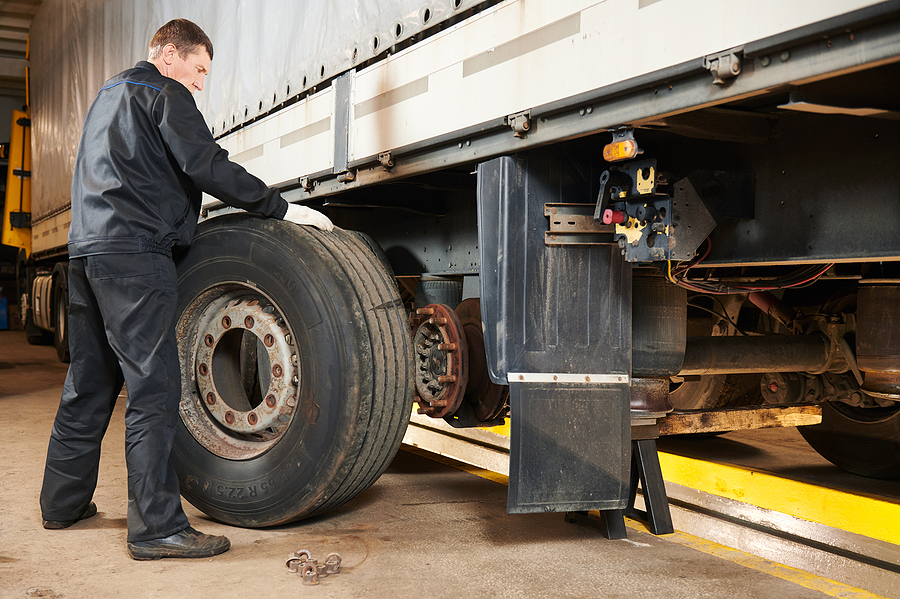 Mechanic changing truck tire